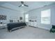 Serene bedroom with ample natural light, neutral tones, and tray ceiling at 1081 Magnolia Warbler Way, Ravenel, SC 29470