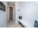 Inviting mudroom with a built-in bench, coat hooks, and easy access to the laundry room and bathroom at 1081 Magnolia Warbler Way, Ravenel, SC 29470