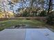 Large fenced backyard with green grass at 110 Cypress St, Summerville, SC 29483