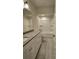 Bathroom featuring a granite countertop, white cabinets, tile floors, and a shower and tub combo at 110 Cypress St, Summerville, SC 29483