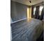 Spacious bedroom featuring sleek gray walls, modern gray vinyl floors, and plenty of natural light at 110 Cypress St, Summerville, SC 29483