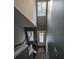 Bright staircase leading to a landing, showcasing wood-look floors and natural light at 110 Cypress St, Summerville, SC 29483