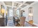 Elegant dining area boasts coffered ceilings, modern light fixture, and an adjacent butler's pantry at 111 Grange Cir, Summerville, SC 29486