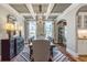 Elegant dining room with coffered ceilings, stylish chandelier, and modern decor at 111 Grange Cir, Summerville, SC 29486
