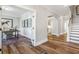 Bright hallway features hardwood floors and an arched entry into the kitchen and a separate office space at 111 Grange Cir, Summerville, SC 29486