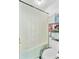 Bathroom featuring a shower with curtain, a toilet, and storage shelving with towels and supplies at 112 Retriever Ln, Goose Creek, SC 29445