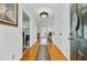 Bright entryway featuring wood floors, neutral walls, and views of the living spaces at 112 Retriever Ln, Goose Creek, SC 29445