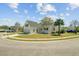 Inviting home featuring a two-car garage, a charming porch, and a beautifully landscaped yard at 112 Retriever Ln, Goose Creek, SC 29445