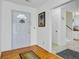 Inviting foyer with hardwood floors, a white door, and access to stairs and hallway at 112 Retriever Ln, Goose Creek, SC 29445