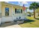 Inviting front porch with flag and hose hookups, offering a warm entrance to the home at 112 Retriever Ln, Goose Creek, SC 29445