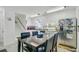 Bright kitchen area with white cabinets, stainless steel appliances, and a table with seating for a cozy dining experience at 112 Retriever Ln, Goose Creek, SC 29445