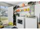 Functional laundry room with washer, dryer, shelving, and an open doorway at 112 Retriever Ln, Goose Creek, SC 29445