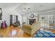 Cozy living room with hardwood floors, fireplace, vaulted ceiling, and sliding glass doors leading to the outdoor area at 112 Retriever Ln, Goose Creek, SC 29445