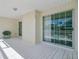 Covered porch area provides comfortable outdoor living with a chair, tile flooring, and sliding doors at 112 Retriever Ln, Goose Creek, SC 29445