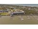 Aerial view of condo community near a picturesque waterfront setting with boat docks and easy waterway access at 116 Bay Creek Villa, Edisto Beach, SC 29438