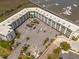 Aerial view of condo with parking and marina access offering convenient waterfront living at 116 Bay Creek Villa, Edisto Beach, SC 29438