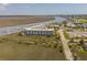 An aerial shot showcasing a beautiful waterfront condo with marsh views and marina access at 116 Bay Creek Villa, Edisto Beach, SC 29438