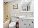 Cozy bathroom with a shower-tub combo and white vanity with unique hardware at 116 Bay Creek Villa, Edisto Beach, SC 29438