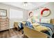 Charming bedroom featuring twin beds, a dresser, and nautical-themed decor at 116 Bay Creek Villa, Edisto Beach, SC 29438