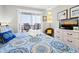 Bright bedroom with balcony access, comfortable furniture, and relaxing decor at 116 Bay Creek Villa, Edisto Beach, SC 29438