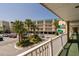 View of the building exterior showing multiple units with balconies and parking area at 116 Bay Creek Villa, Edisto Beach, SC 29438