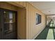 Exterior hallway leading to unit 116 with view of outdoor scenery at 116 Bay Creek Villa, Edisto Beach, SC 29438
