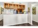 Efficient kitchen featuring granite countertops, display cabinets, and an open-concept layout at 116 Bay Creek Villa, Edisto Beach, SC 29438