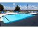 Community pool with lounge chairs and views of the marina at 116 Bay Creek Villa, Edisto Beach, SC 29438