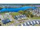 Beautiful aerial view of community with lake, swimming pool, and attractive single Gathering homes with attached garages at 122 Yorkshire Dr, Moncks Corner, SC 29461