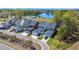 A high angle shows houses in a neighborhood next to a pond and pool at 122 Yorkshire Dr, Moncks Corner, SC 29461
