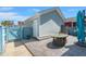 Cozy backyard patio featuring outdoor furniture and privacy fence at 122 Yorkshire Dr, Moncks Corner, SC 29461