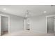 Spacious, well lit bedroom with neutral walls and carpet, and multiple doorways adding to the room's layout at 122 Yorkshire Dr, Moncks Corner, SC 29461