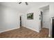 Bright bedroom featuring hardwood floors, neutral walls, and an art piece creating a cozy and inviting atmosphere at 122 Yorkshire Dr, Moncks Corner, SC 29461