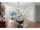 Charming dining room with a decorative chandelier and an open view into the living area at 122 Yorkshire Dr, Moncks Corner, SC 29461