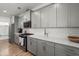 Spacious kitchen with stainless steel appliances, white quartz countertops, and ample storage at 122 Yorkshire Dr, Moncks Corner, SC 29461