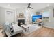 Bright living room featuring a fireplace, hardwood flooring and a large-screen television at 122 Yorkshire Dr, Moncks Corner, SC 29461