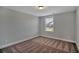 A gray bedroom with carpet, window, and view to the neighborhood at 128 Cantona Dr, Summerville, SC 29483
