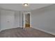 Large bedroom with neutral walls, carpeted flooring, and natural light with multiple doors at 128 Cantona Dr, Summerville, SC 29483