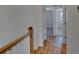 Hallway with wood floors, wainscotting, and access to bedrooms at 128 Cantona Dr, Summerville, SC 29483