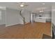 Open-concept living room with a staircase, kitchen, and living area at 128 Cantona Dr, Summerville, SC 29483
