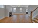 Spacious living room with a fireplace, wood floors, and large windows at 128 Cantona Dr, Summerville, SC 29483