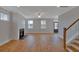 Bright living room featuring a fireplace and open access to the stairway and front door at 128 Cantona Dr, Summerville, SC 29483
