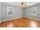 Comfortable bedroom with hardwood floors, neutral walls and two windows letting in natural light at 1298 French Santee Rd, Jamestown, SC 29453