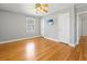 Bedroom with hardwood floors, grey walls, ceiling fan and a mounted flat screen TV at 1298 French Santee Rd, Jamestown, SC 29453