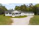 Charming single-story home with a welcoming front porch and attached garages at 1298 French Santee Rd, Jamestown, SC 29453