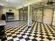 The garage features black and white checkered floor, shelving, and garage door access at 1298 French Santee Rd, Jamestown, SC 29453