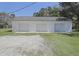 A large detached three-car garage features white siding and trim at 1298 French Santee Rd, Jamestown, SC 29453