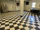 Garage space includes stainless steel refrigerator and checkered flooring, with plenty of storage at 1298 French Santee Rd, Jamestown, SC 29453