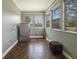 Well-lit laundry room features modern washer, tile flooring, and windows offering natural light at 1298 French Santee Rd, Jamestown, SC 29453