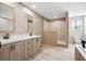 Bathroom with dual sinks, shaker cabinets, a walk-in shower, and a separate toilet area, maximizing space and privacy at 1360 Burr Hill Rd, Cottageville, SC 29435